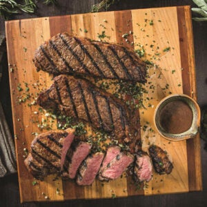 A steak served on a wooden plank