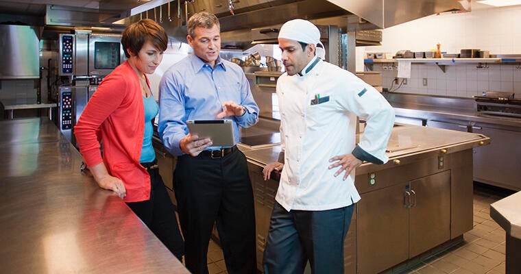 A food distribution salesman explains menu substitutions to healthcare kitchen managers.
