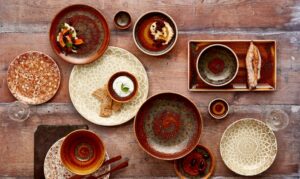 table top looking at a selection of brown dishes for restaurant dinnerware trends